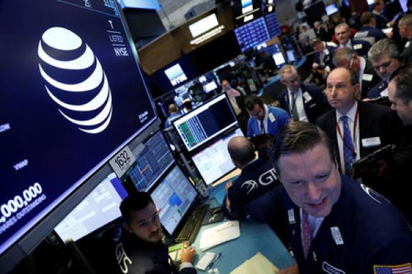 AT&T Rises 4%