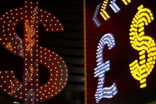 Dollar steadies, Yuan down as China cuts growth target