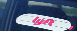 Lyft logo on a car glass